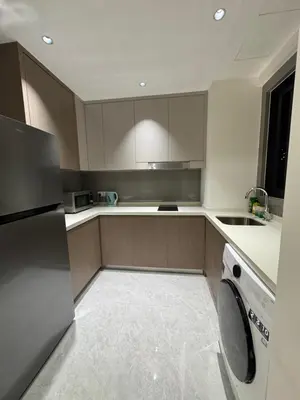 a kitchen with a washer and a dishwasher at KLCC View Suites By Agile in Kuala Lumpur