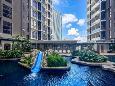 a water slide in a mall with tall buildings at KLCC Spacious Top Floor, Grand, Slides and Big Bathtub Kula Lumpur in Kuala Lumpur