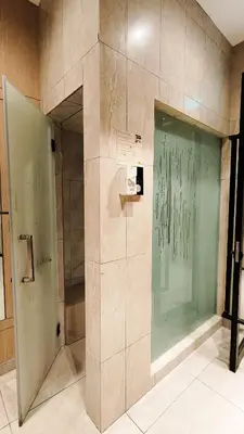 a shower with a glass door in a bathroom at Axon Residence Bukit Bintang Pavilion TRX by Fie in Kuala Lumpur