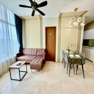 a living room with a couch and a table at sky suites klcc by dp in Kuala Lumpur