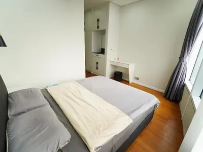 a small bedroom with a bed in a room at Tomato Homestay By Sky Suites KLCC in Kuala Lumpur