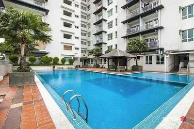 a large blue swimming pool in front of a building at Happy Homes 1 Kuala Lumpur in Kuala Lumpur