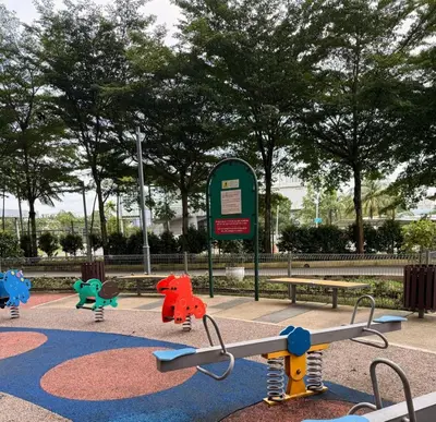 a playground in a park with a bench at Happy Homes 1 Kuala Lumpur in Kuala Lumpur