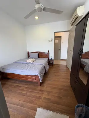 a bedroom with a bed and a ceiling fan at Happy Homes 1 Kuala Lumpur in Kuala Lumpur