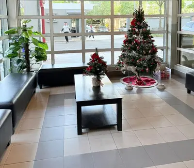 a living room with a christmas tree and a coffee table at Happy Homes 1 Kuala Lumpur in Kuala Lumpur