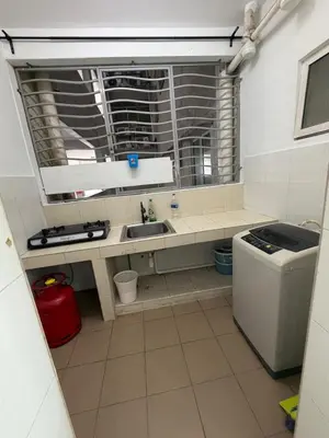 a small kitchen with a sink and a window at Happy Homes Kuala Lumpur 21-12 in Kuala Lumpur