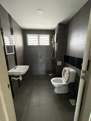 a bathroom with a toilet and a sink at Happy Homes Kuala Lumpur 21-12 in Kuala Lumpur