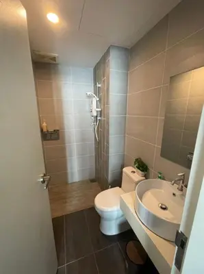 a bathroom with a toilet and a sink at Arte Plus Homestay Condo in Kuala Lumpur