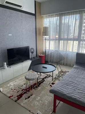 a living room with a couch and a table at Arte Plus Homestay Condo in Kuala Lumpur