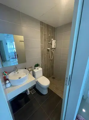 a bathroom with a toilet and a sink at Arte Plus Homestay Condo in Kuala Lumpur