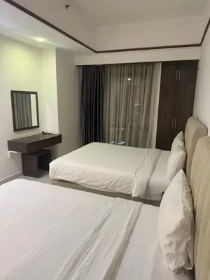 a hotel room with a bed and a window at Hotel Bintang Inn in Kuala Lumpur