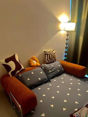 a bedroom with a couch with a teddy bear on it at Only Girls Condo at KL city, near monorail in Kuala Lumpur