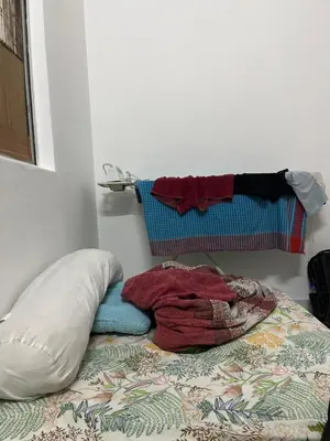 a bed with a pillow and a blanket on it at Regalia Residence in Kuala Lumpur
