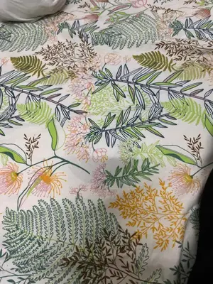 a bedsheet with a floral pattern on it at Regalia Residence in Kuala Lumpur