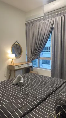 a bedroom with a bed with a desk and a window at Razak City Sunset HHhomestay 2R 2B Netflix Utube in Kuala Lumpur