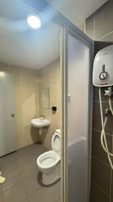 a bathroom with a toilet and a sink at Razak City Sunset HHhomestay 2R 2B Netflix Utube in Kuala Lumpur