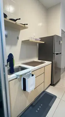 a kitchen with a sink and a refrigerator at Razak City Sunset HHhomestay 2R 2B Netflix Utube in Kuala Lumpur