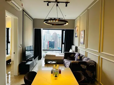 a living room with a couch and a table at Crystal At Axon Residence KL in Kuala Lumpur
