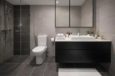 a bathroom with a toilet and a sink and a shower at Axon Bukit Bintang By Sleeping Bird in Kuala Lumpur