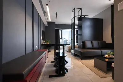 a living room with a couch and a table at Axon Bukit Bintang By Sleeping Bird in Kuala Lumpur