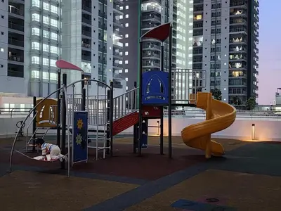 a playground with a slide and a slide at Cozy Razak City 2B2B KLCC View Near KL Centre in Kuala Lumpur