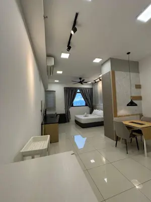 a living room with a couch and a table at Chamber Residence klcc by Cozy white in Kuala Lumpur