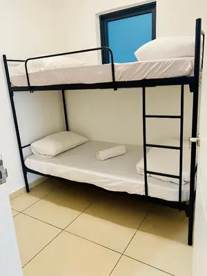 two bunk beds in a room with a window at Supper Suite By Reizz Residence in Kuala Lumpur