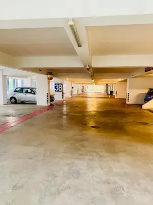 an empty parking garage with a car parked in it at Supper Suite By Reizz Residence in Kuala Lumpur
