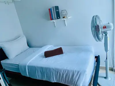 a hospital room with a bed and a fan at Supper Suite By Reizz Residence in Kuala Lumpur