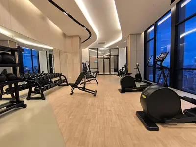 a gym with treadmills and ellipticals in a building at Tour & Travel Malaysia Axon Residence Bukit Bintang KL in Kuala Lumpur
