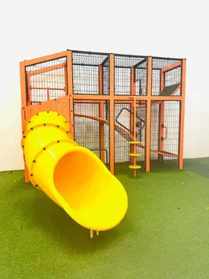 a yellow slide in front of a playground at Cherry Homes at Chambers by Golden in Kuala Lumpur