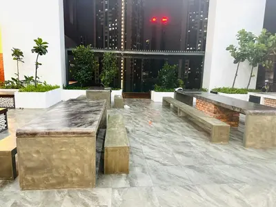 a lobby with benches in a building with skyscrapers at Cherry Homes at Chambers by Golden in Kuala Lumpur