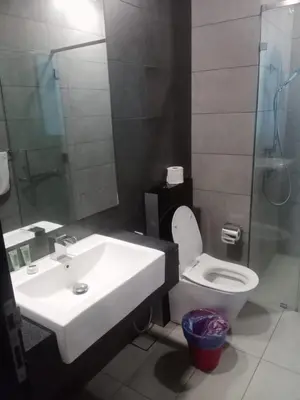 a bathroom with a sink and a toilet and a shower at First World Suite At Opus Residence KL 118 in Kuala Lumpur
