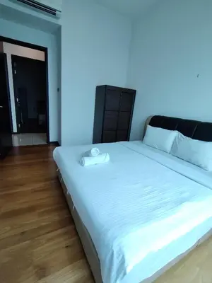 a bedroom with a white bed with a blue light at First World Suite At Opus Residence KL 118 in Kuala Lumpur