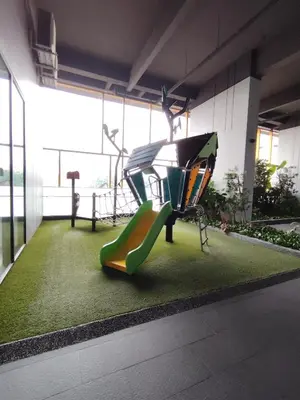 a playground in a building with a slide at First World Suite At Opus Residence KL 118 in Kuala Lumpur