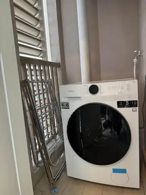 a white washing machine sitting in a room at Dorsett Hartamas with Rooftop Pool and Bathtub in KL City #215 in Kuala Lumpur