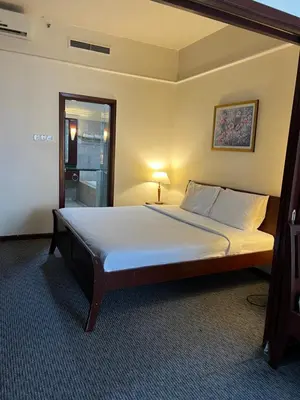 a bedroom with a large bed in a room at Apartment TS at Times Square in Kuala Lumpur