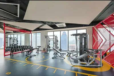 a gym with treadmills and cardio equipment in a building at KL Majestic VIP studio Massage Chair 26-1A KLCC view in Kuala Lumpur