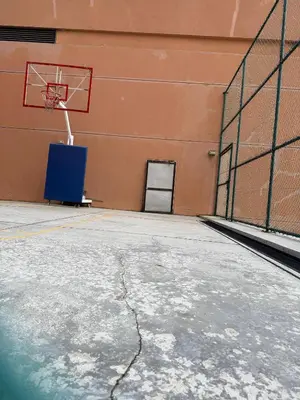 an empty gym with a basketball hoop in a building at Residential Family Apartments At Times Square KL in Kuala Lumpur