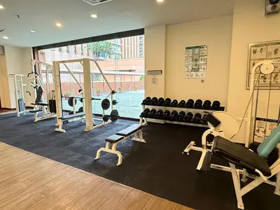 a gym with treadmills and machines in a room at Residential Family Apartments At Times Square KL in Kuala Lumpur