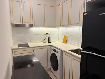 a kitchen with a dishwasher and a sink in it at Axon Residence KLCC By Premium Suite in Kuala Lumpur