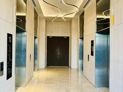 a hallway with a black door in a building at Axon Residence KLCC By Premium Suite in Kuala Lumpur