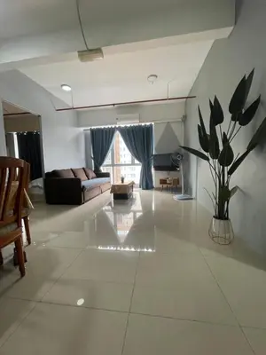 a large living room with a couch and a table at Nour Homestay KLCC View - COMFORT in Kuala Lumpur