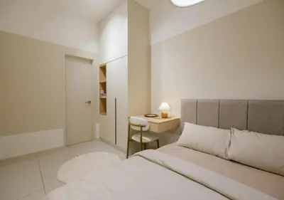 a white bedroom with a bed and a desk at Cozy Cityscape Homestay in KL City Center 1-5pax in Kuala Lumpur