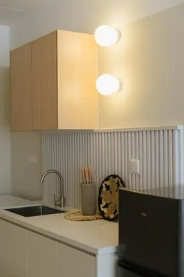 a kitchen with a sink and a counter top at Cozy Cityscape Homestay in KL City Center 1-5pax in Kuala Lumpur