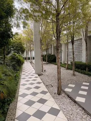 a checkered walkway in a park with trees at UNA Residence Maluri MRT Velocity TRX Bkt Bintang in Kuala Lumpur