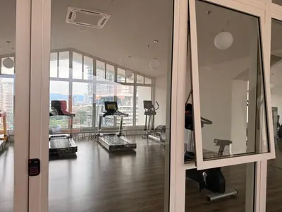an empty room with a gym with a large window at UNA Residence Maluri MRT Velocity TRX Bkt Bintang in Kuala Lumpur
