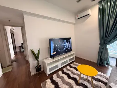 a living room with a flat screen tv on a wall at UNA Residence Maluri MRT Velocity TRX Bkt Bintang in Kuala Lumpur