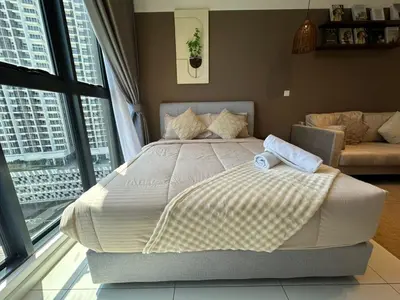 a large bed in a room with a large window at Majestic Suites Klcc BY Mimi in Kuala Lumpur