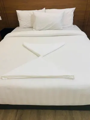a white bed with white sheets and pillows at agile residence at gorgeous luxury in Kuala Lumpur